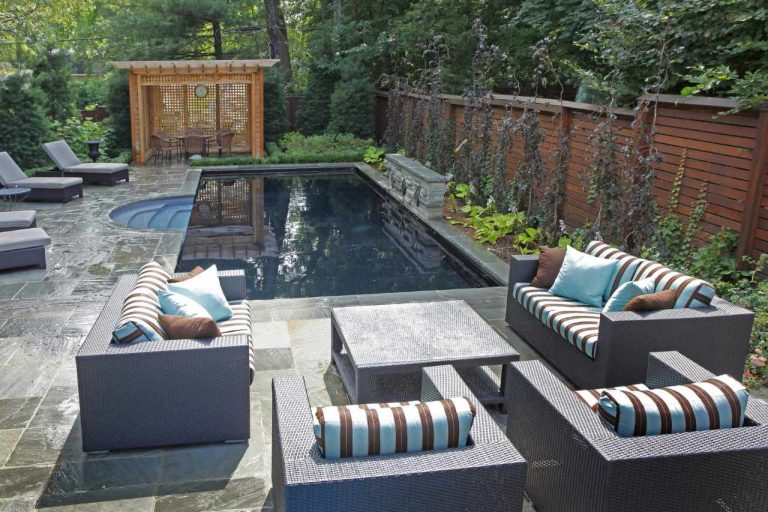 plunge pool in brisbane in beautifully decorated backyard with dining set