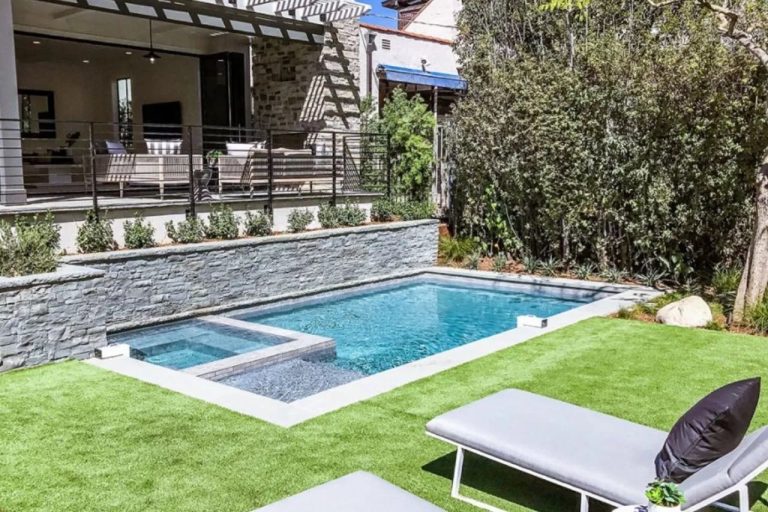 rectangle plunge pool brisbane in open backyard with lounge chairs