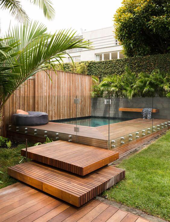 Plunge pool surrounded by ornamental grasses and thoughtfully designed pool landscaping, creating a natural and elegant outdoor ambiance.