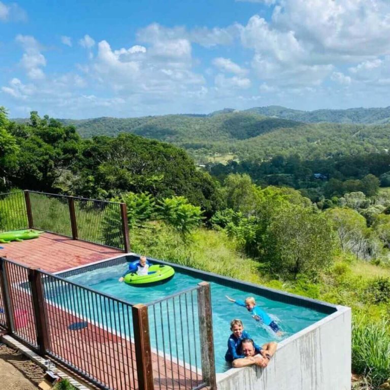 A family enjoying a day of fun and relaxation in the rectangle above ground pool, highlighting its 4m² of bench space and ample room for socializing.