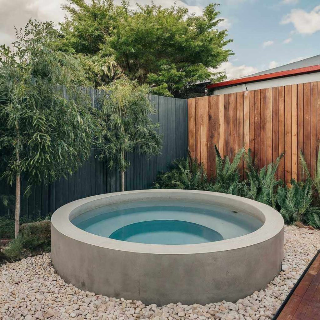 semi above-ground round plunge pool in stunning backyard