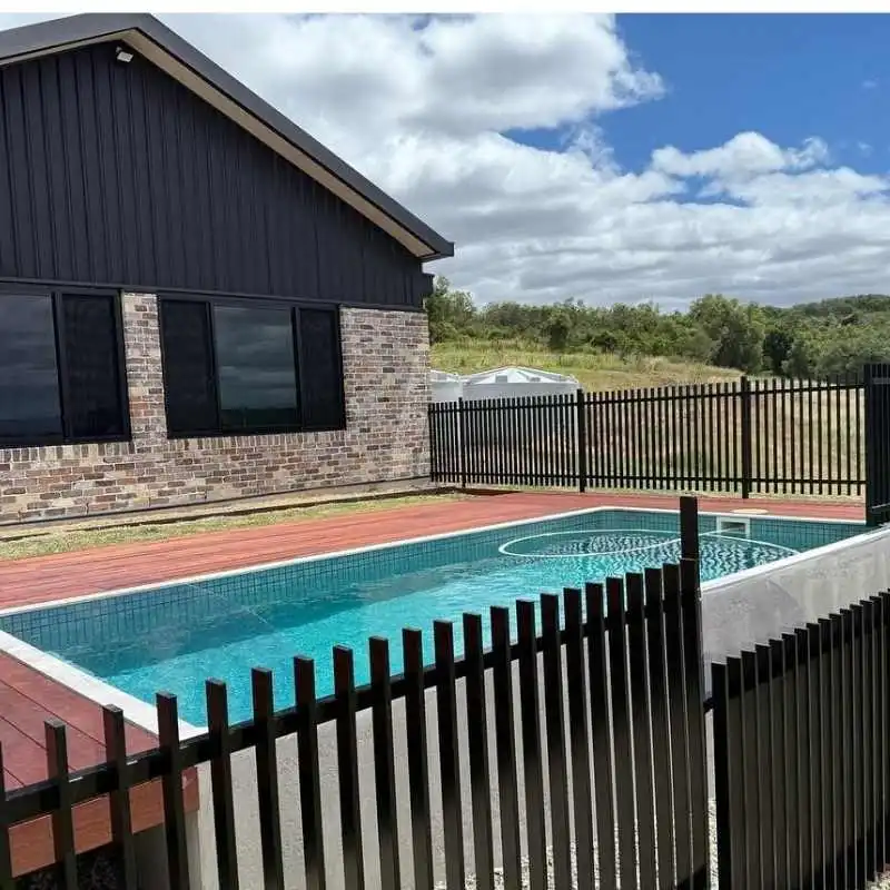 Above ground plunge pool with raised structure and safety fencing in Camp Hill property