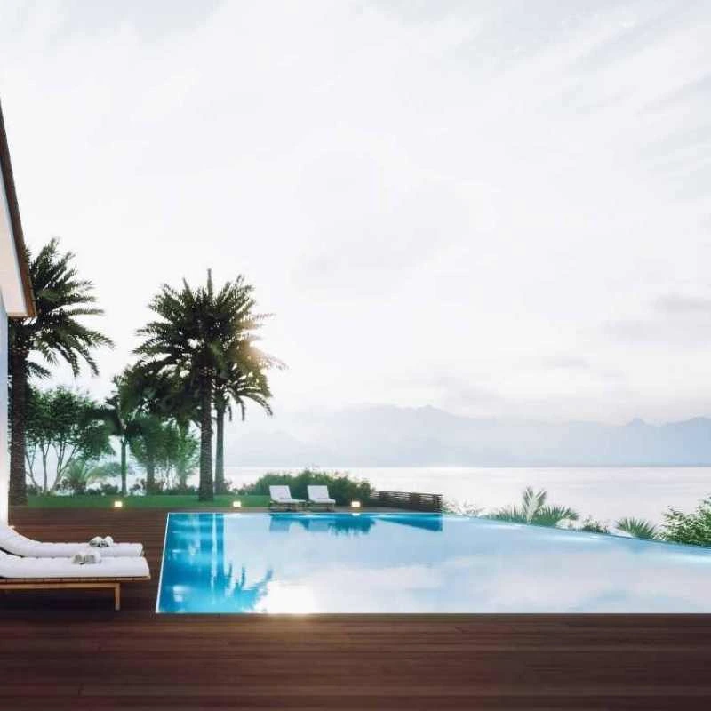 Infinity edge plunge pool overlooking coastal view with timber deck in luxury Grange home