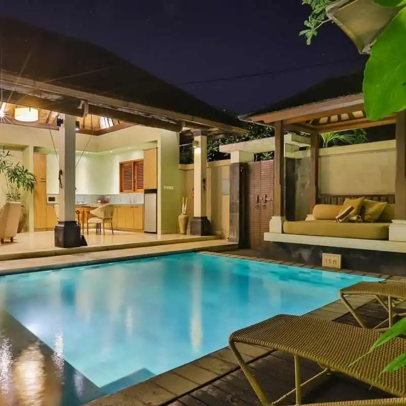 Inground plunge pool with glass fencing and contemporary two-storey house in Calamvale