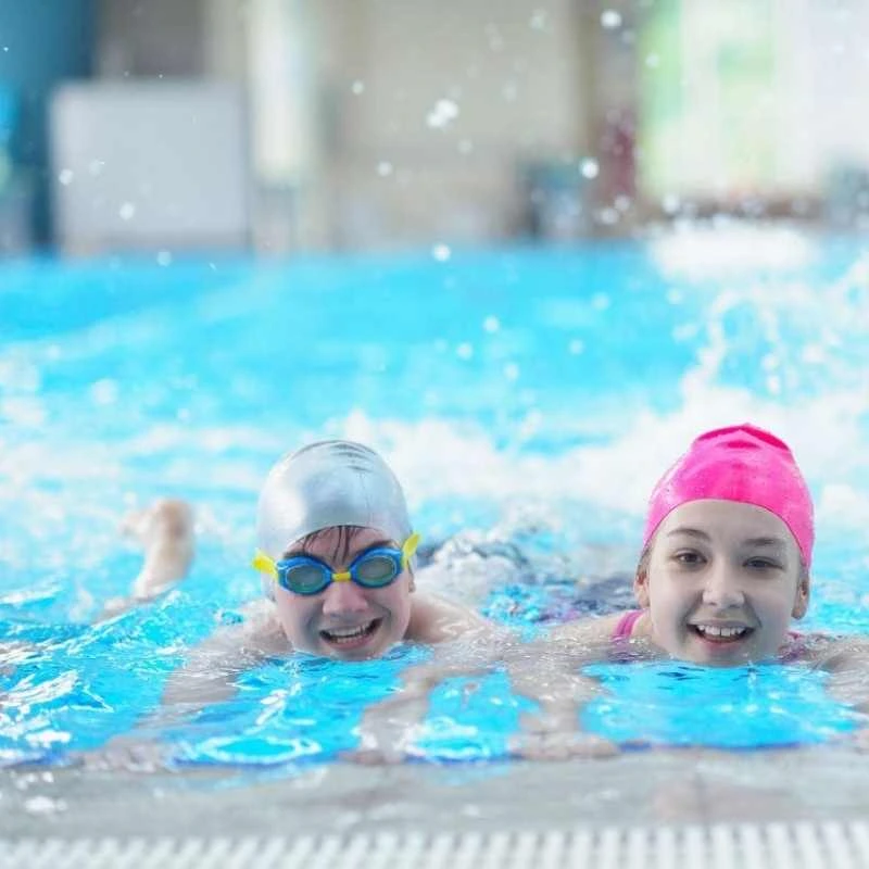 Plunge pool builder installation with LED lighting and glass fencing in Grange outdoor area